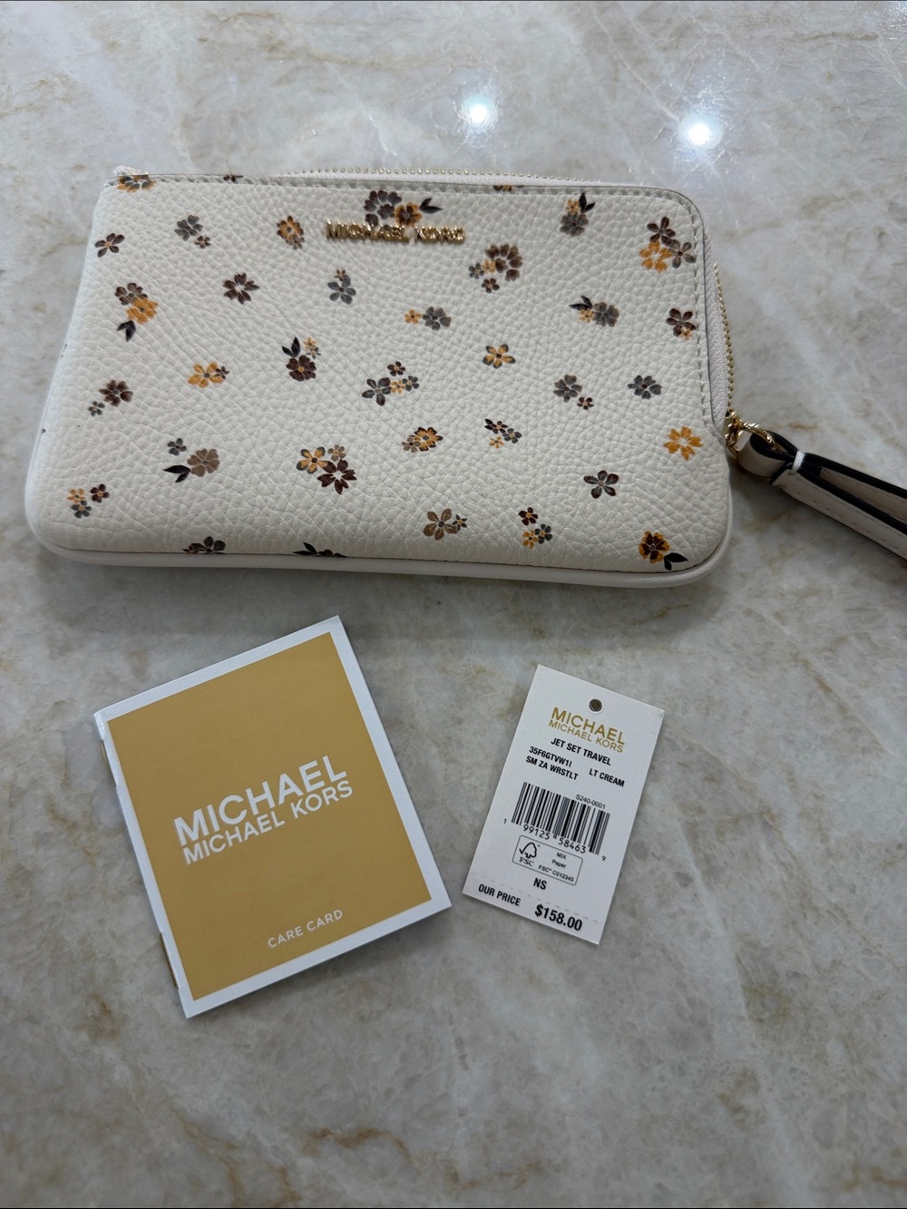 Michael Kors Cream Floral Zip Wristlet Phone Case with Gold Logo
